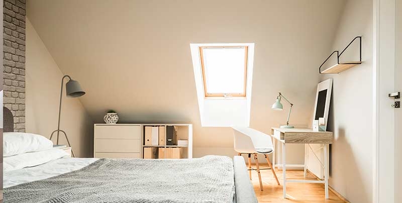 Real-photo-of-bright-Nordic-style-attic-room-interior-with-woode