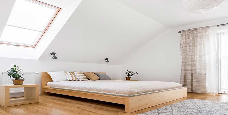 Wooden-bed-in-cozy-bedroom